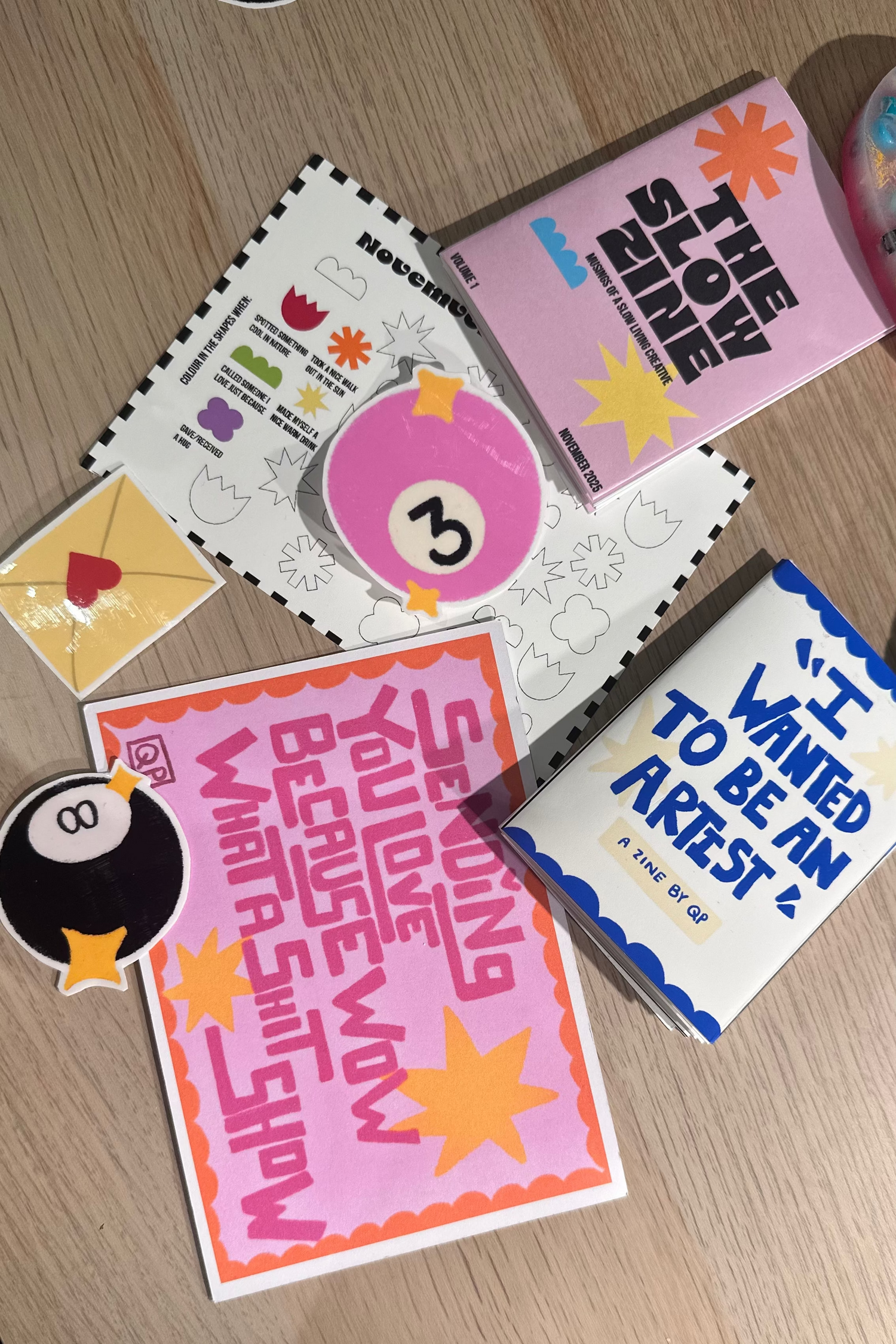 Collection of two illustrated hand folded zine, 3 colourful vinyl stickers, one offline activity card and an illustrated post card that you get when you'll subscribe to The Slow Zine Club for November