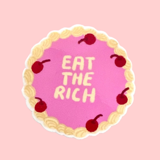 Vinyl Sticker with 'Eat the Rich' text on a pink vintage cake background with cherries, on a light gray surface.